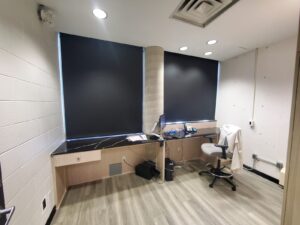 Modern office at City Playhouse Theatre in Vaughan with a contemporary desk, ergonomic chair, computer setup, and recessed lighting, designed for improved functionality and staff productivity.